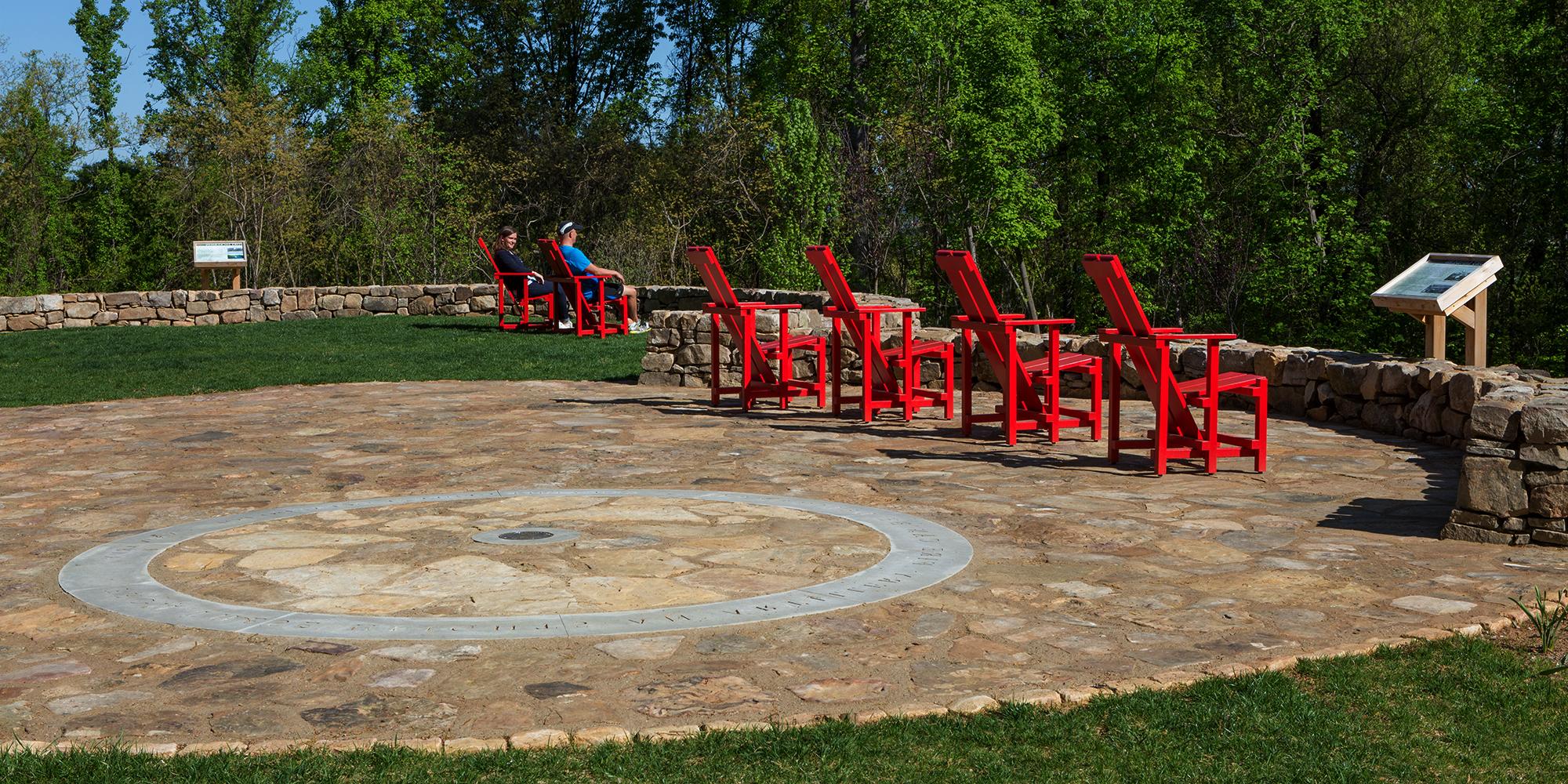 Seating area with red lawn chairs at High Ground Park